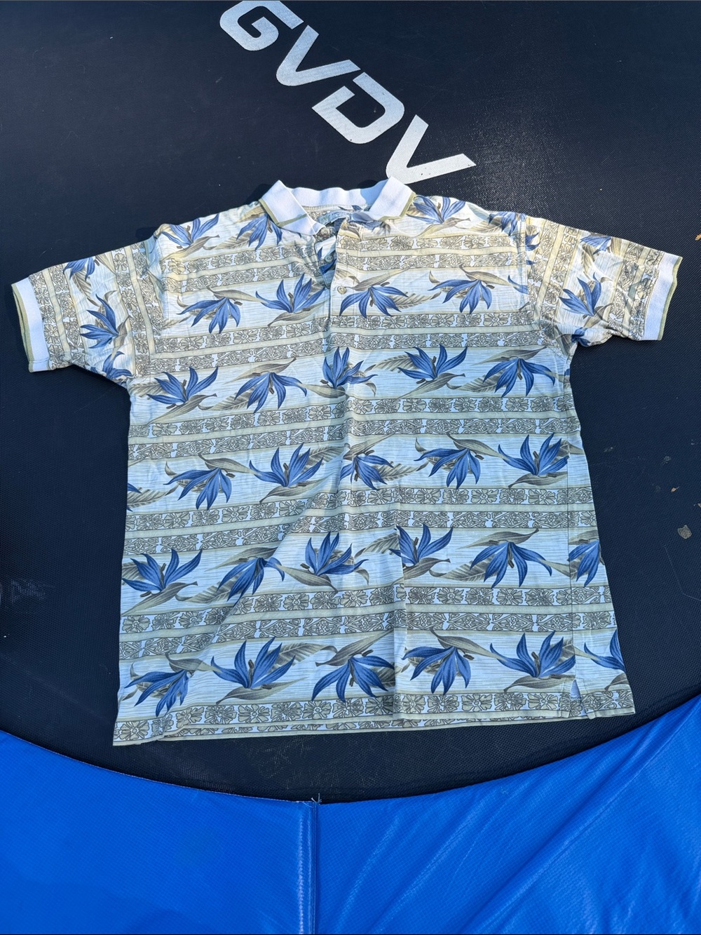 Vintage Men's Blue Floral Polo Shirt with Subtle Stripe Pattern